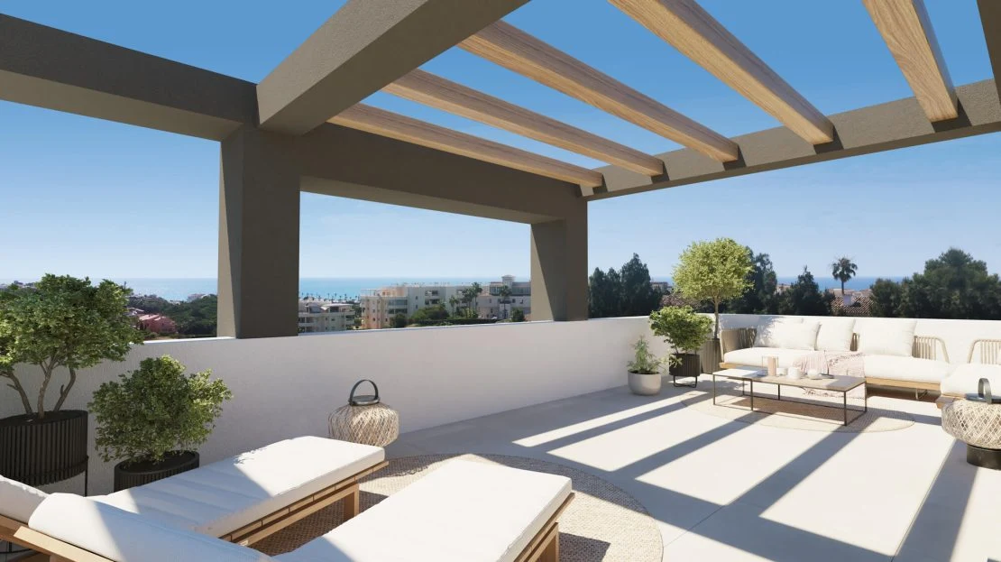 Rooftop solarium met loungezithoek en zeezicht