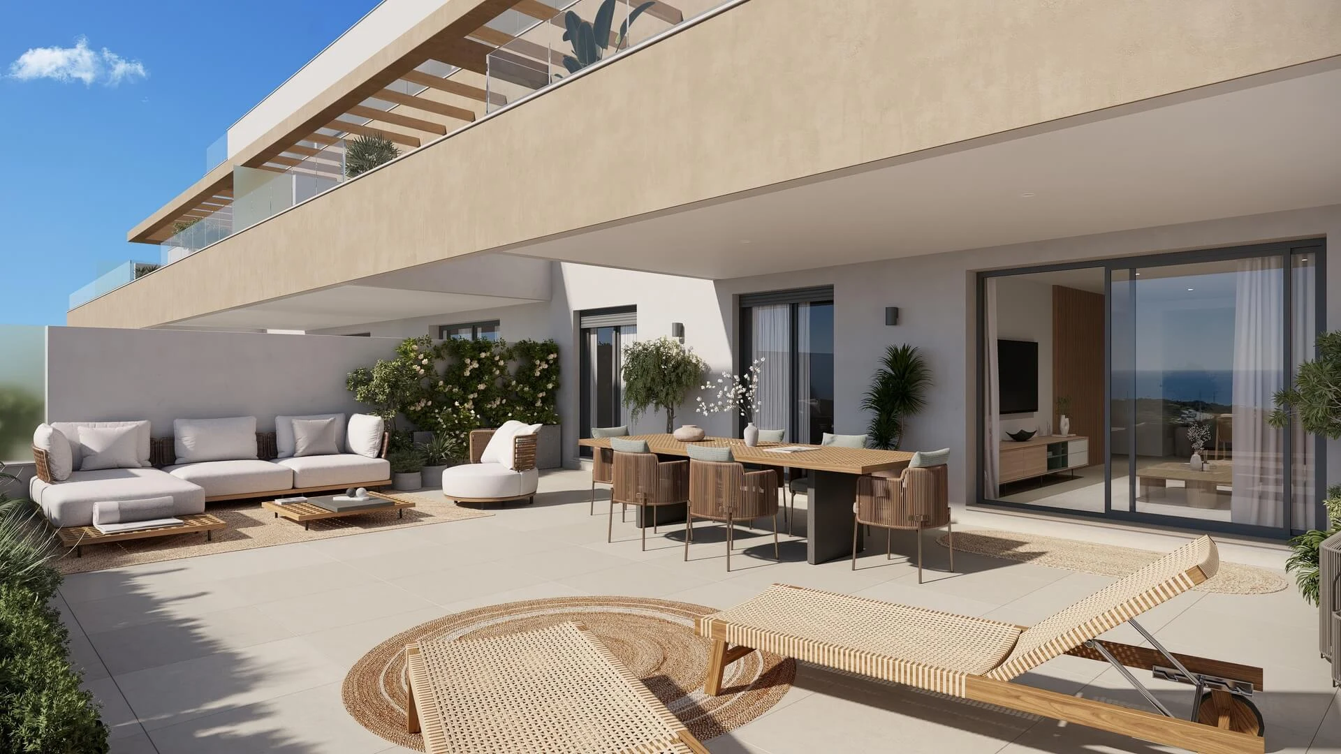 Gelijkvloers terras met loungezetels en pergola