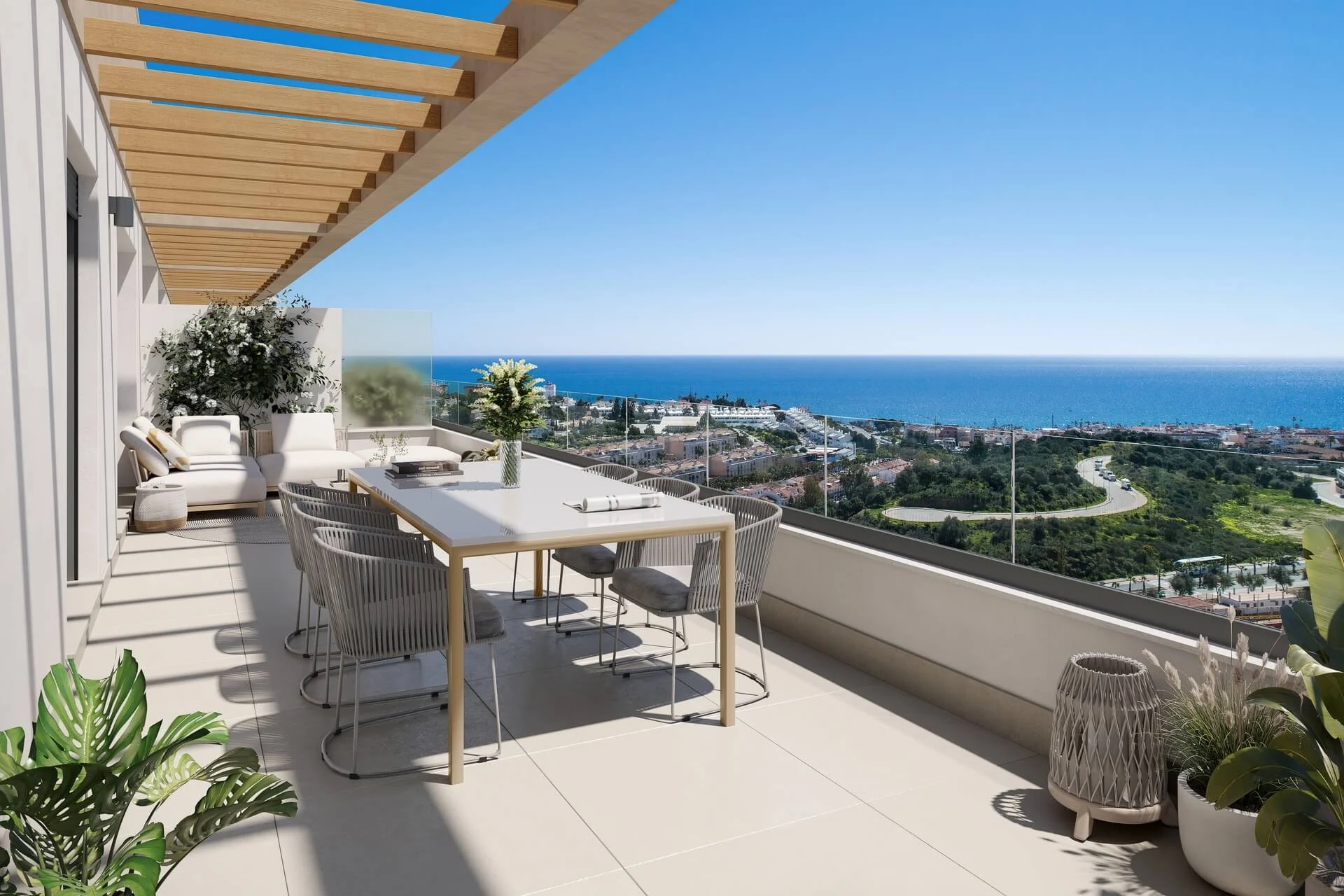 Terras met eettafel en panoramisch zicht op zee
