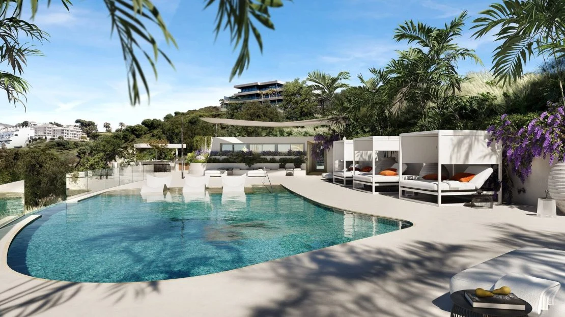 Zwembad en tuinen van Macan Beach Residences aan het strand