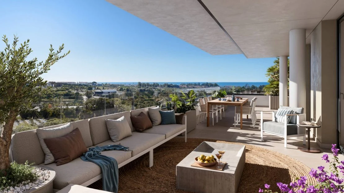 Terras van een UNELMA appartement met buitenmeubelen